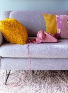 Pink telephone on sofa